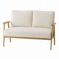 Modernes Zweisitzer-Sofa mit Holzrahmen und cremefarbenem Bouclé-Bezug